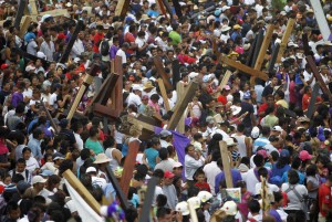 Thousands of people participate in a re-enactment of the crucifixion of Jesus Christ on Good Friday in Iztapalapa